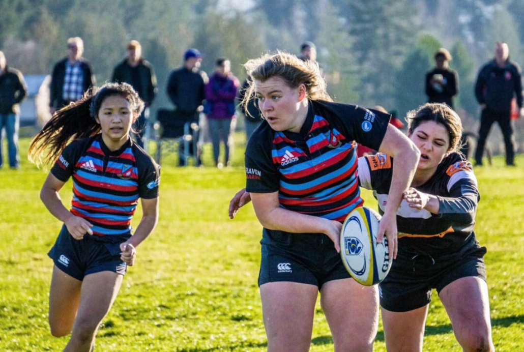 A female rugby player in action