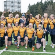 University of Victoria Vikes Women's Rugby 7s team pose for a team photo after winning gold against UBC