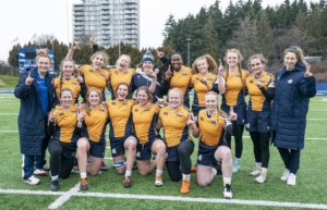University of Victoria Vikes Women's Rugby 7s team pose for a team photo after winning gold against UBC