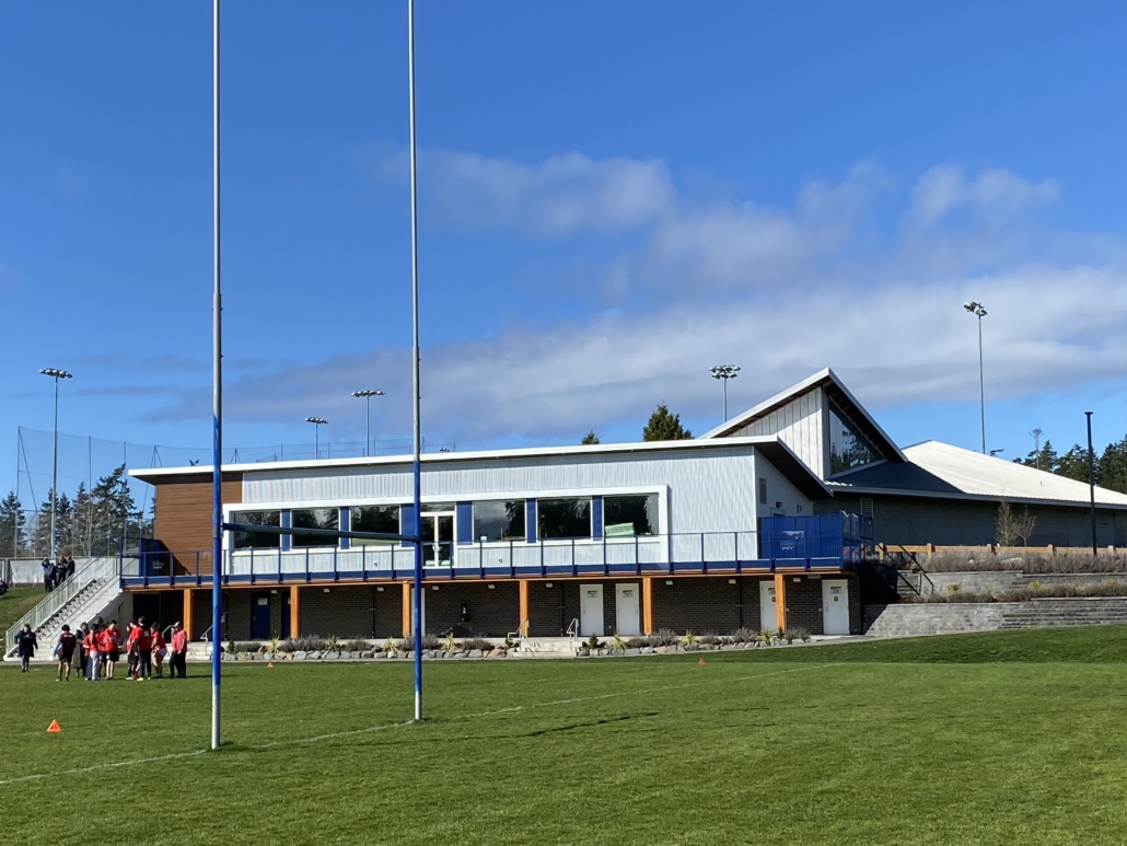 A generic view of a Rugby Clubhouse and pitch with Rugby posts in front of shot