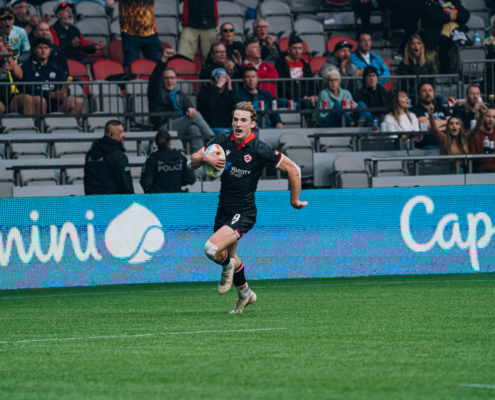 A Rugby player runs with the ball at BC Place Stadium