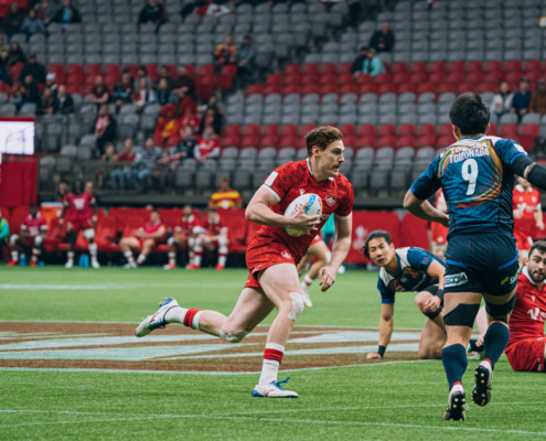 Canada player Phil Berna dodges a tackle on the BC Place field