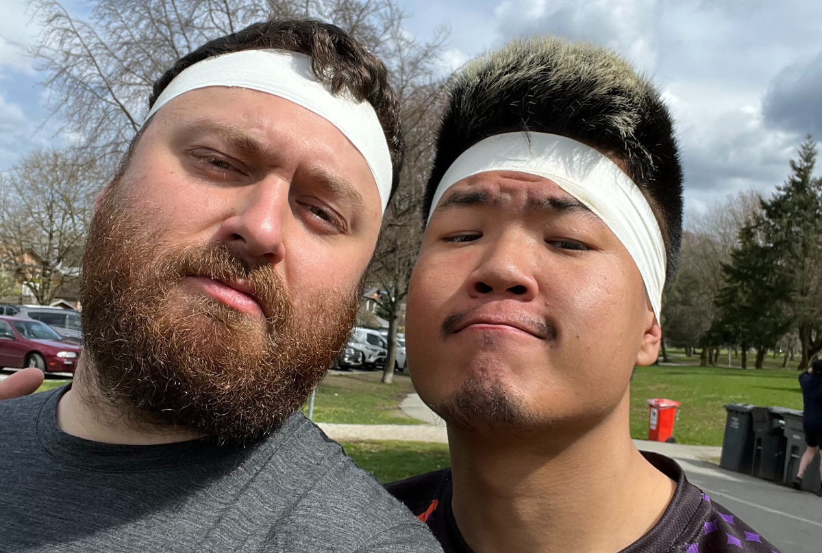 Two maleRugby players take a selfie after training