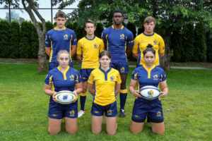 Four male and three female players model the new navy and gold BC Bears kits