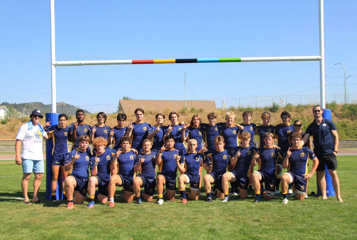 BC Bears U18 Boys Blue Team poses for a photo underneath the posts