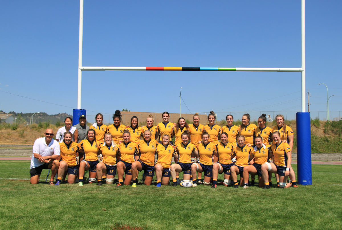 BC Bears U23 Women's Team poses for a photo underneath the posts