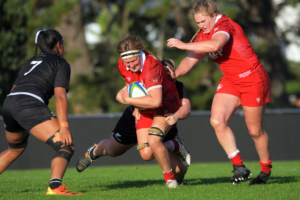 Rugby Canada player Tyson Beukeboom carries the ball through a tackle