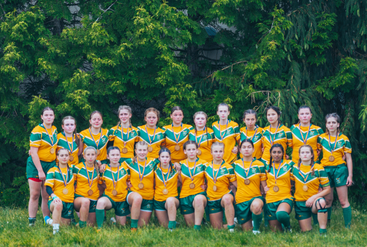 The Fraser Valley Rugby Union U16 Girls team poses with gold medals after a match