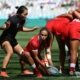 A female player throws the ball during the Rugby World Cup 7s match between Canada and China