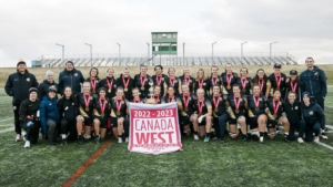The UBC Thunderbirds pose after winning the 2022 Canada West Championship