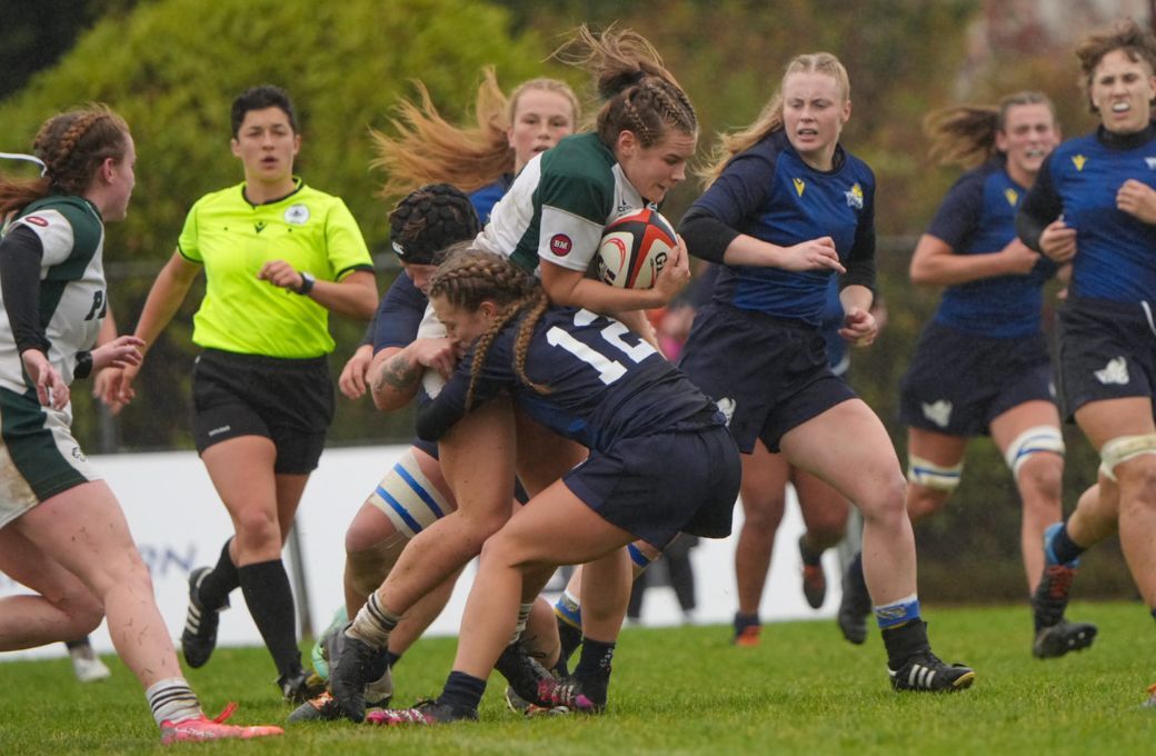 A UVIC Vikes Player tackles a UPEI player during the consolation semi-final at the 2022 U SPORTS Rugby Championship