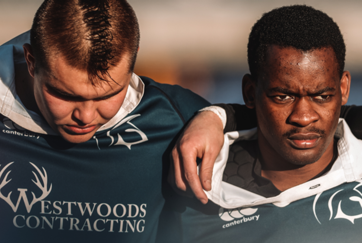 A close up of two Trinity Western Spartans players at the 2022 Canadian University Men's Rugby Championship