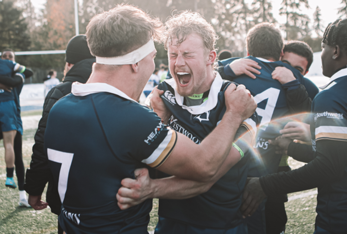 Trinity Western Spartans players celebrate 2022 National Championship victory over UVIC Vikes