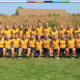 The BC Bears U18 Girls team poses for a team photo underneath the posts after a match at the 2022 Western Canadian Championships