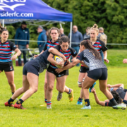 A Castaway Wanderers player is tacked by a UBC player during the Women's Premier League final at 2022 BC Rugby Senior Club Finals