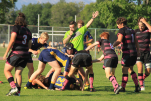 A referee blows for a penalty during a match between BC Bears and Alberta
