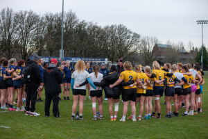 Players huddle at the end of a BC Rugby Senior Blue vs Gold match