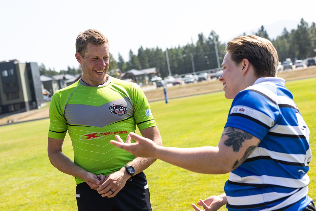 Chris Assmus talks with a player