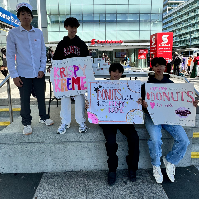 StrongHer Society selling donuts as a fundraiser