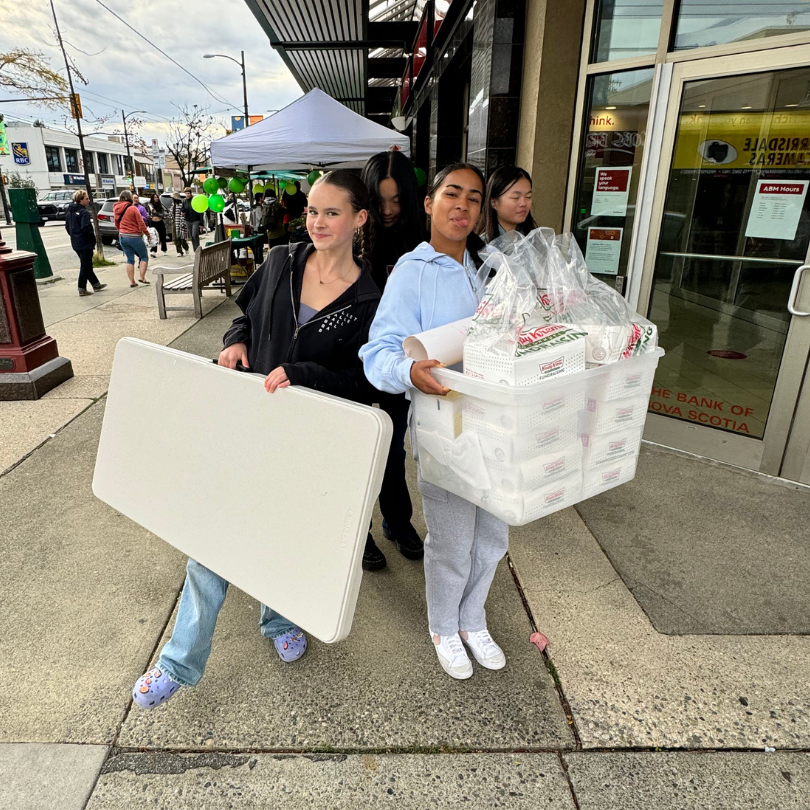 StrongHer Society selling donuts as a fundraiser